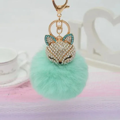 porte cle renar pompon fausse fourrure vert
